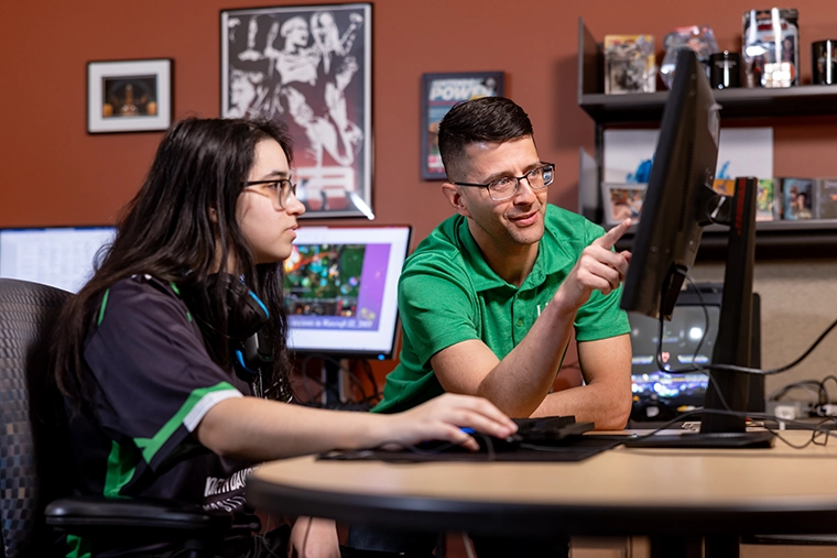 UND esports student with instructor
