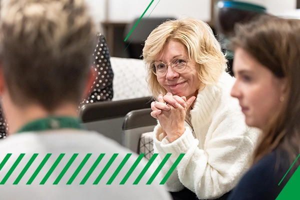 education instructor helping student on und campus
