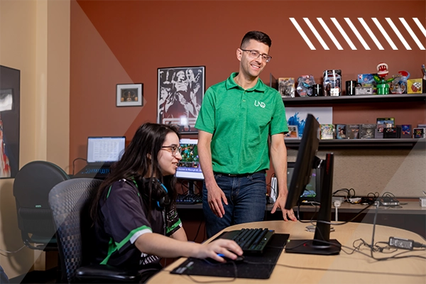 male instructor helping students