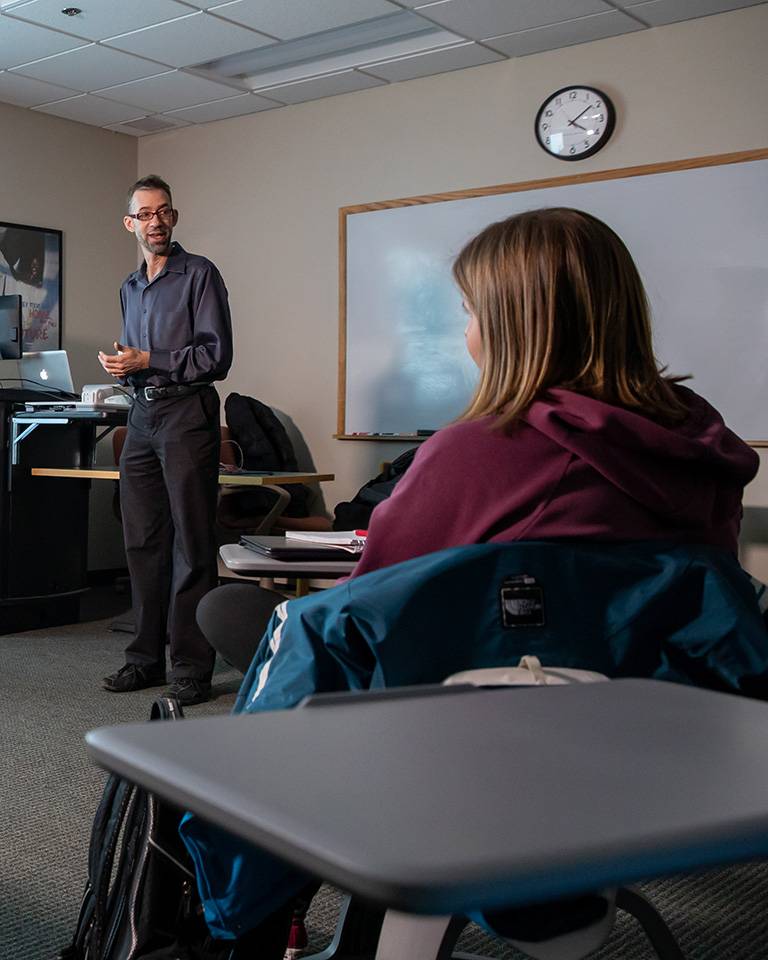 UND education graduate teaching a college class