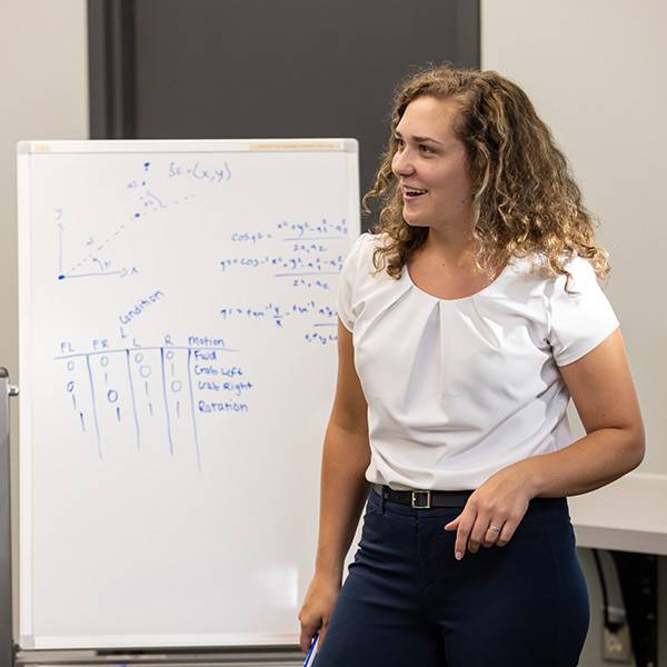 Student in front of white board
