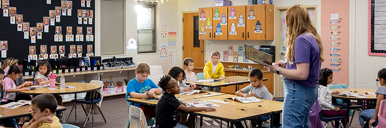 teacher in front of classroom
