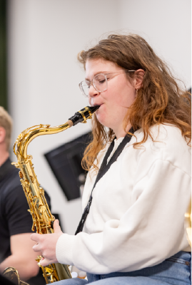 Student playing the saxophone Student playing the saxophone