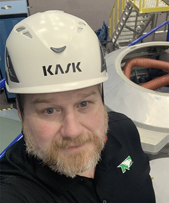 photo of dr jesse rhoades wearing a hardhat
